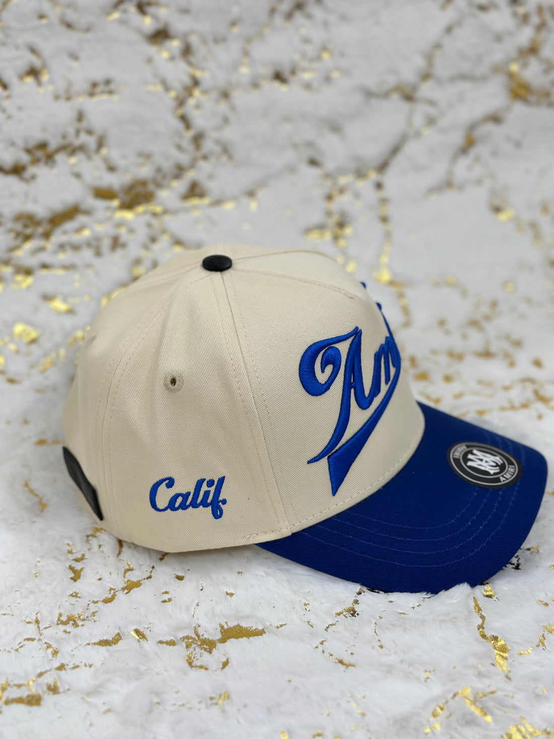 Elitecaps™ AMIRI Cream & Royal Blue Cap – Premium Streetwear Style
